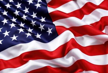 A zoomed in photo of the American flag blowing in the breeze.
