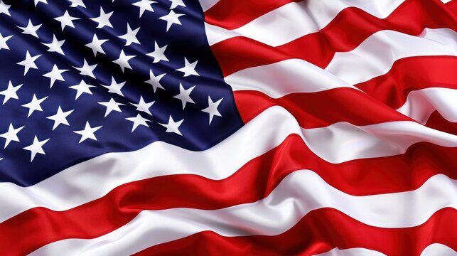 A zoomed in photo of the American flag blowing in the breeze.