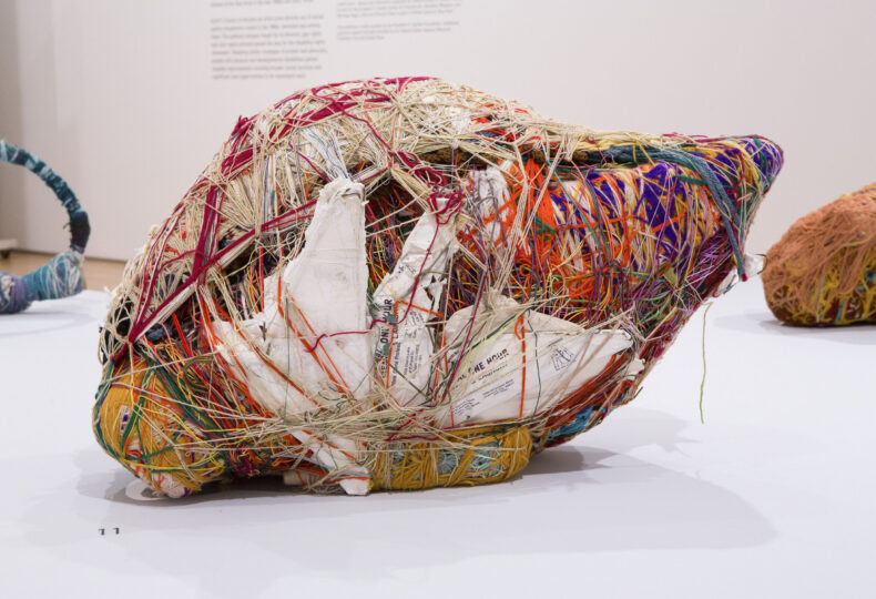 Sample of Judith Scott's fiber arts piece that was on display in a museum. She uses a combination of string, paper and other recycled materials.