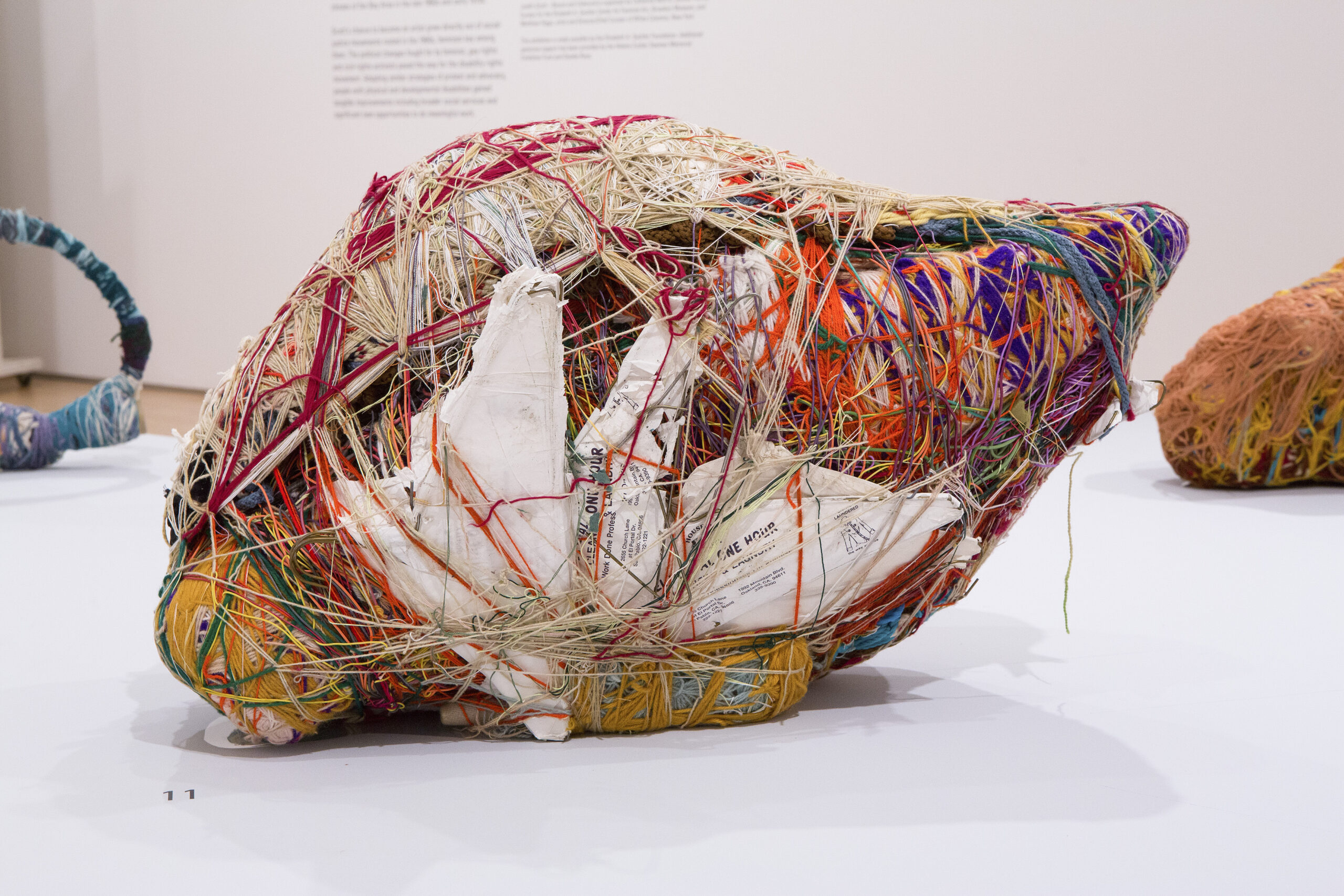 Sample of Judith Scott's fiber arts piece that was on display in a museum. She uses a combination of string, paper and other recycled materials.